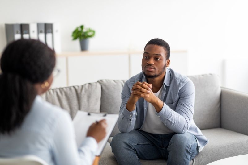 Psychotherapist with a patient discussing a ketamine treatment for treatment-resistant depression.