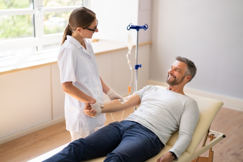 Doctor administering ketamine therapy to a patient at Caledon Clinic