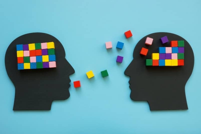 Two heads with colourful blocks to signify types of psychotherapy